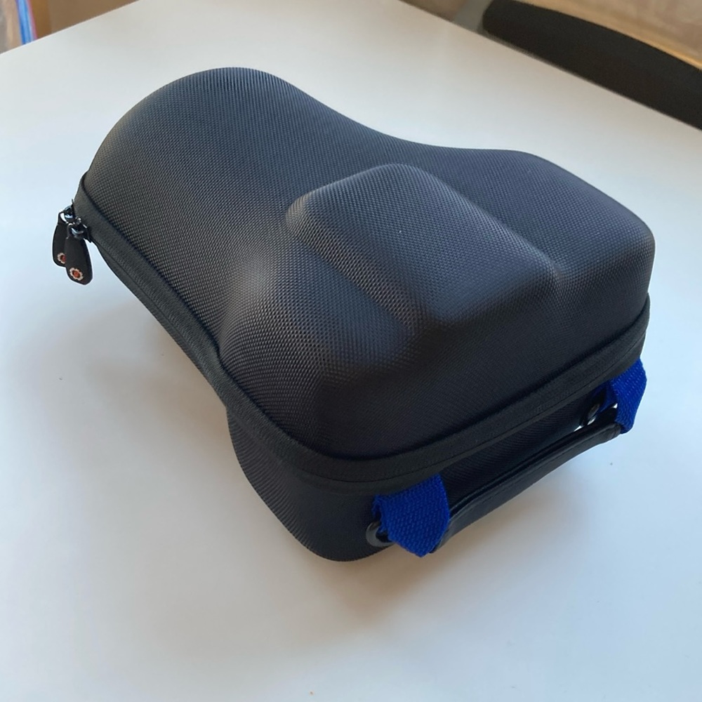 Hard carrying case for long-lens camera with strap